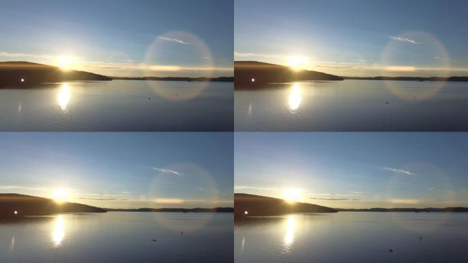 湖上日落的无人机视图