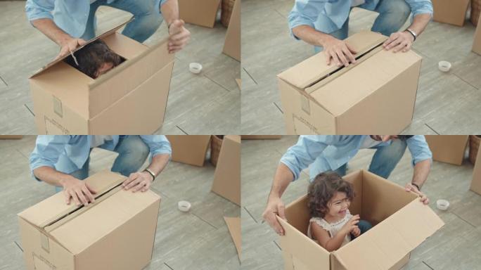 女婴跳出纸板箱使家人感到惊讶