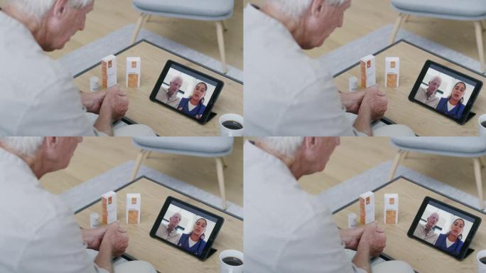 一个成熟男人使用数字平板电脑与护士进行视频通话的4k视频录像