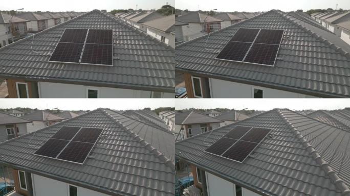 带太阳能屋顶的房子的鸟瞰图。清洁能源