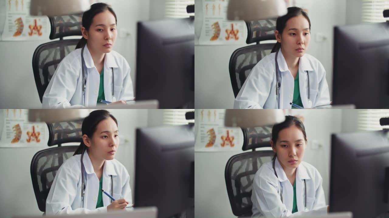 女医生在医院工作空间使用数字平板电脑