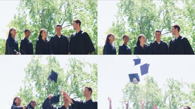 毕业那天快乐的学生向空中扔帽子。兴奋而积极的毕业生欢呼和庆祝他们的学业成就。为美好的未来而兴奋的朋友