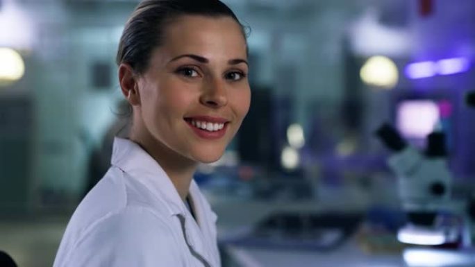 4k视频片段，一名自信的年轻女子在实验室工作