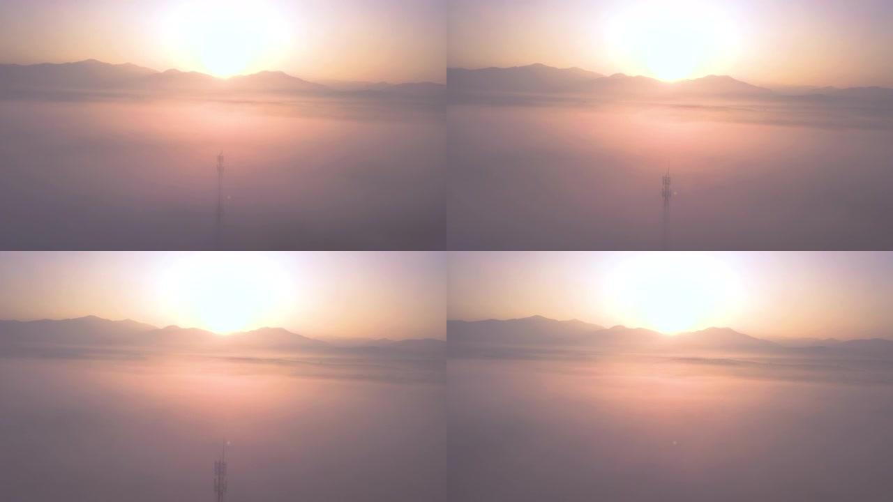 日出时云和山脉上方的鸟瞰图
