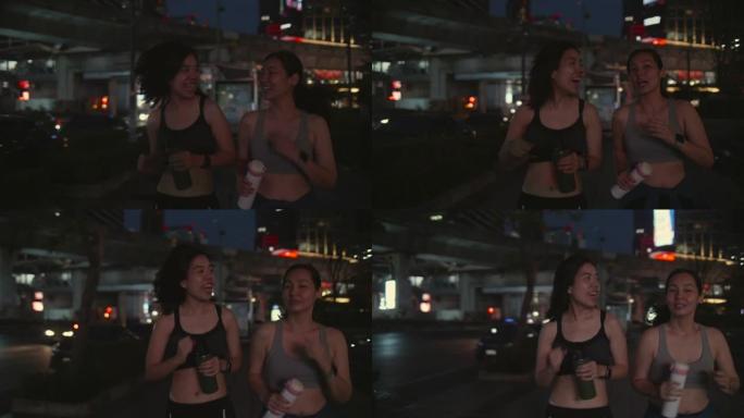 两名亚裔女子晚上下班后一起慢跑