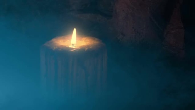 蜡烛在烟熏的中世纪环境中燃烧并吹灭