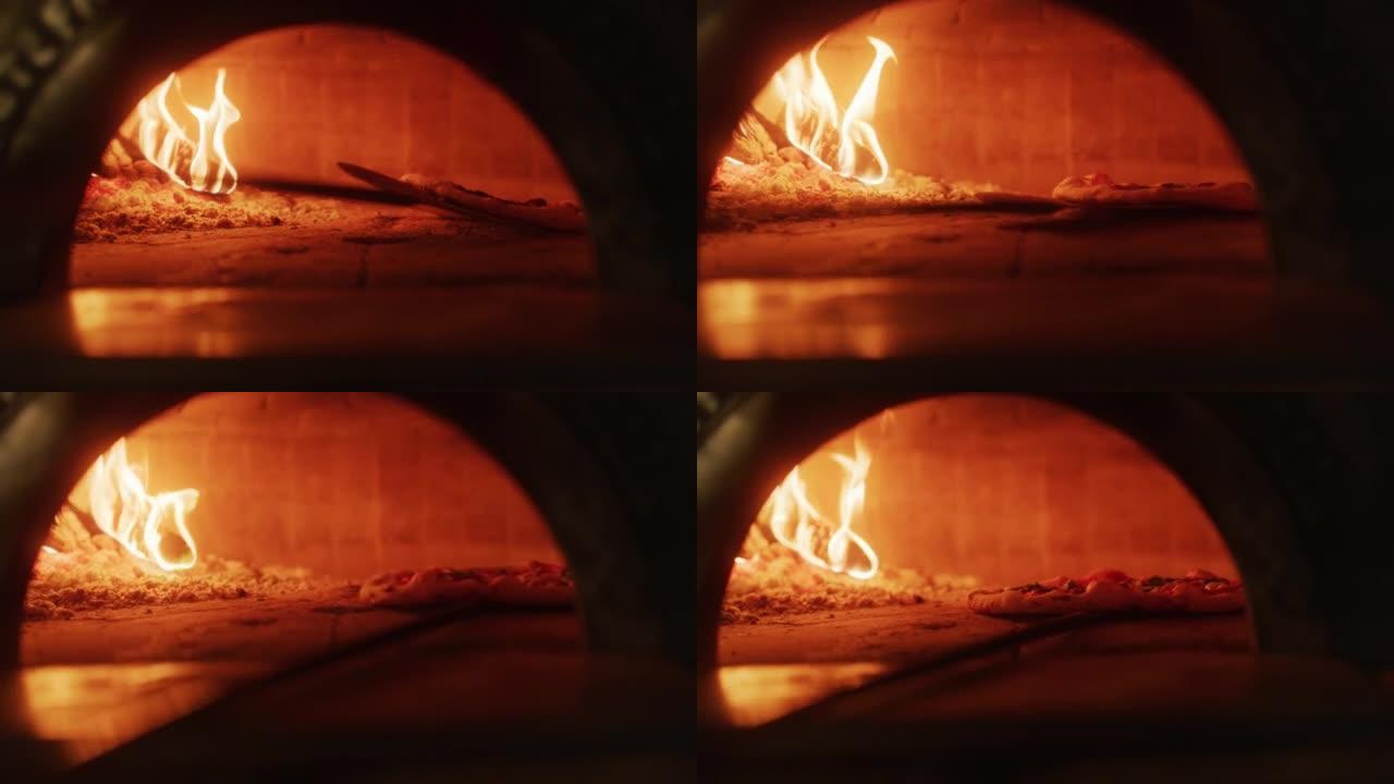 在餐厅披萨皮将披萨转移到木火石烤箱中。传统烹饪，意大利家庭食谱。正宗的比萨店，有美味的有机食品。电影