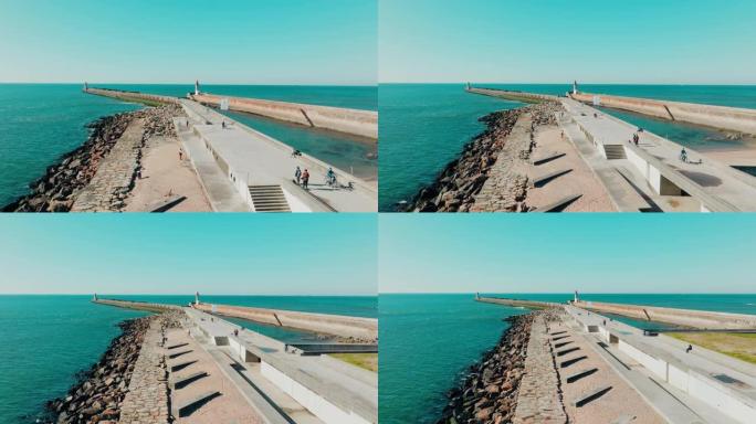 灯塔Felgueirasin波尔图的无人驾驶飞机视图，有海浪和城市景观，阳光明媚的日子