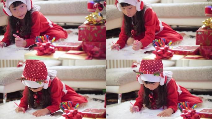 小女孩为圣诞节打包礼物
