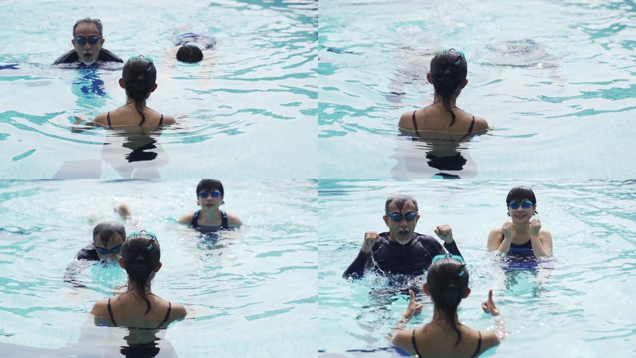 亚洲中国活跃的高级夫妇游泳运动员在游泳池向教练练习游泳