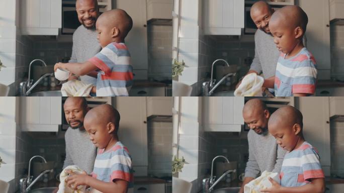 一个英俊的成熟男人和他的儿子在家洗碗的4k视频片段
