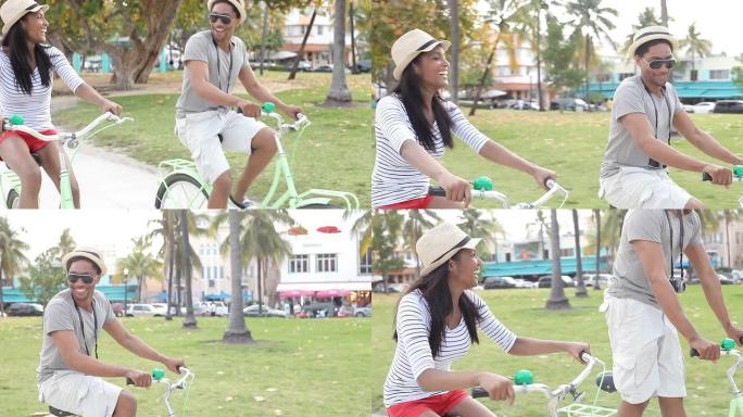 年轻夫妇骑自行车玩得开心