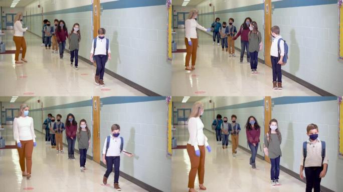 学生在新型冠状病毒肺炎期间在学校走廊戴口罩