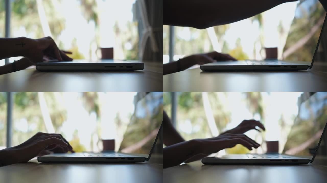 女人开始在笔记本电脑上工作