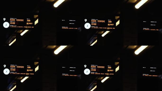 晚上在意大利威尼斯的圣卢西亚火车站的火车信息板。特写。