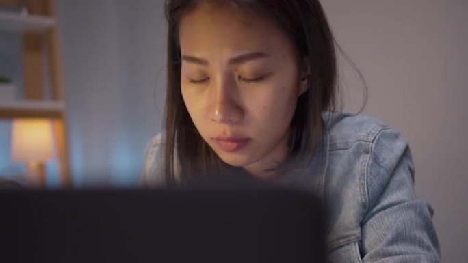 特写脸亚洲女性看电脑笔记本