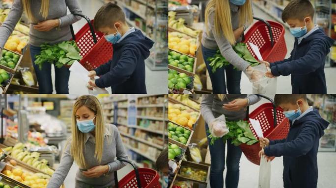 母子俩戴着医用口罩的真实照片，以保护自己免受疾病的侵害，在超市一起购物。