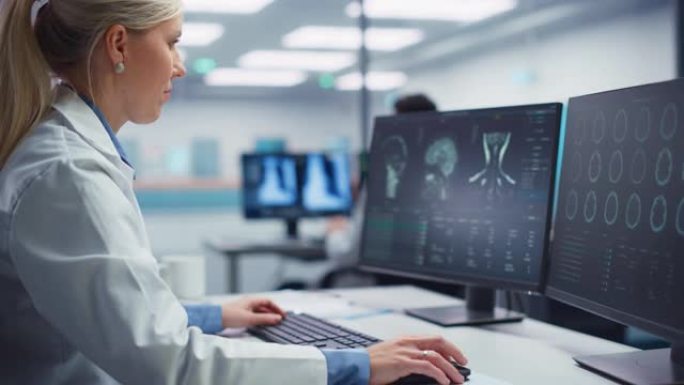 医学医院研究实验室: 女性神经外科医生使用计算机进行脑部扫描MRI图像，为患病患者找到最佳治疗方法。