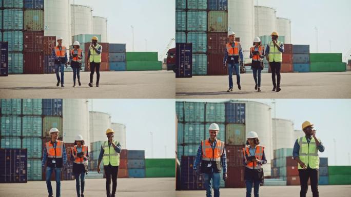 由各种各样的工业工程师，安全主管和工头组成的团队，他们戴着安全帽和安全背心在货运集装箱码头仓库行走。