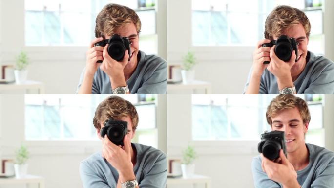 一个年轻人使用数码相机拍照的4k视频片段