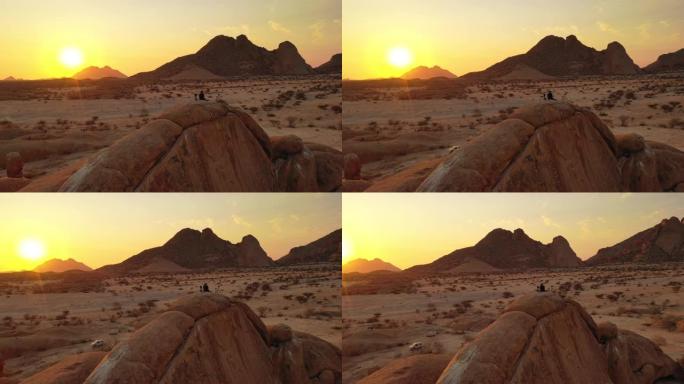 WS摄影师在非洲纳米比亚的沙漠景观上观看日落