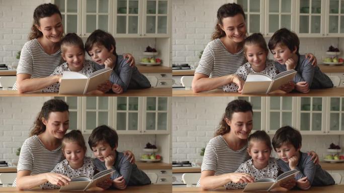 微笑的年轻母亲给小孩子读纸质书。