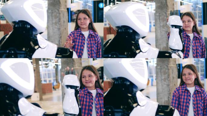 机器人科学、技术、创新概念。机器人在特写镜头中与一个女孩接触手
