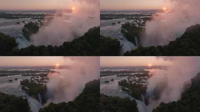 高空中日出可以看到水雾和水流过维多利亚瀑布边缘，联合国教科文组织世界遗产