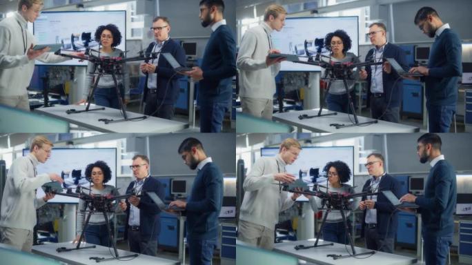 航空工程师团队在新的无人机上工作，进行讨论，在科学实验室中使用笔记本电脑。不同的科学家交谈和检查。启