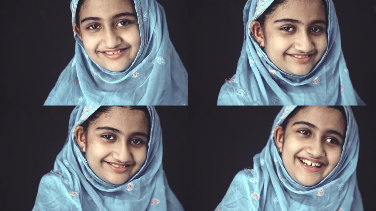 微笑的穆斯林女孩的肖像