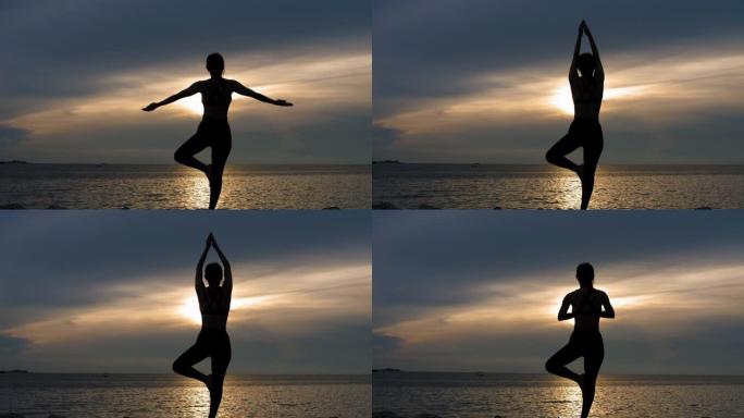 剪影女孩在日落时在海滩上摆树瑜伽姿势
