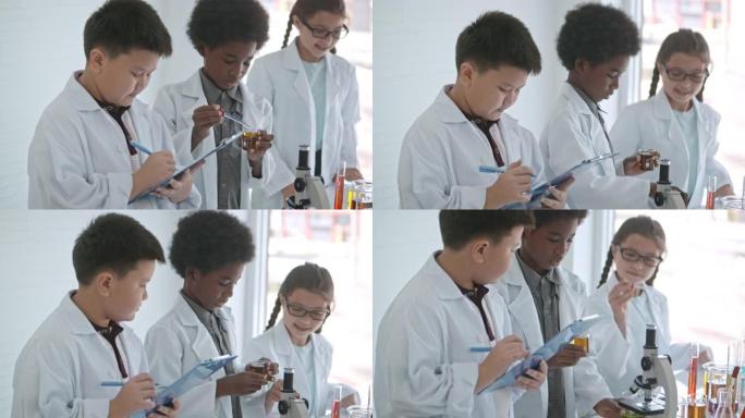 可爱的男孩和女孩进行科学实验