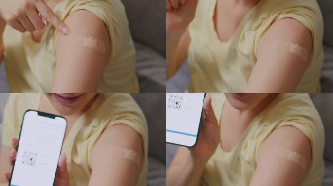特写亚洲女子接种疫苗后在智能手机上展示国际新型冠状病毒肺炎疫苗接种证书
