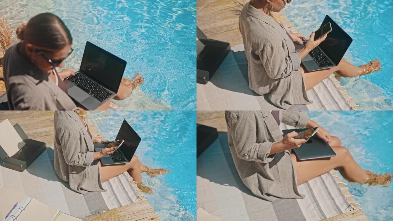 年轻女子在游泳池旁关闭笔记本电脑后打来电话
