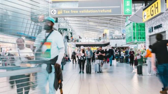 阿姆斯特丹史基浦机场拥挤的通勤游客步行的时间流逝