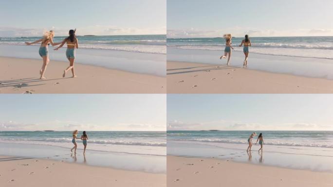 十几岁的女孩在海滩上跑进海里溅在水里玩得开心最好的朋友在假期享受温暖的夏日