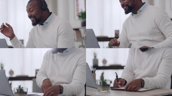 成熟的男性呼叫中心代理戴着耳机在家里的笔记本电脑上接听电话。一名男性客户服务人员正在通话并写书。远程