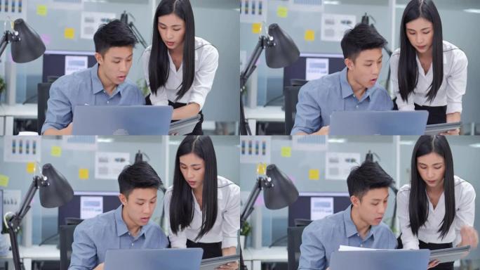 在办公室里，领导亚洲女企业家对年轻男性充满信心，他们使用平板电脑分析数据，同时在深夜工作时交谈并寻找