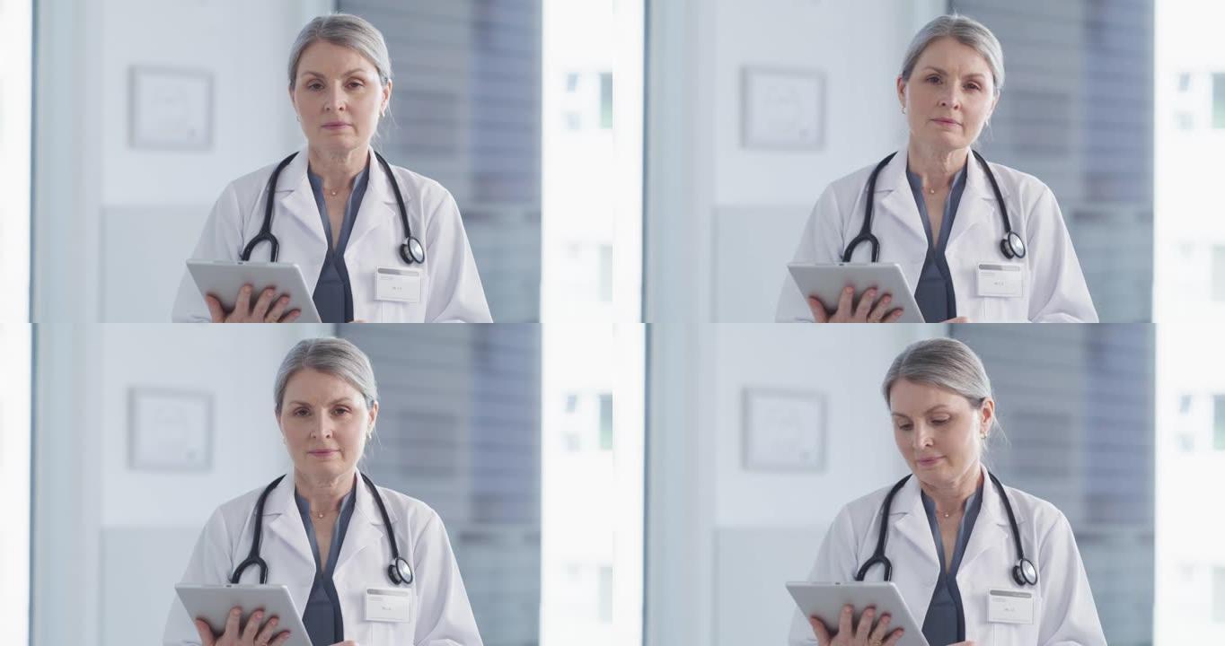 一位有吸引力的成熟女医生在医院工作时使用平板电脑的4k视频片段