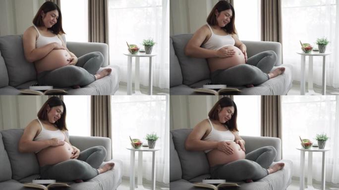 孕妇在肚子里抚摸儿子