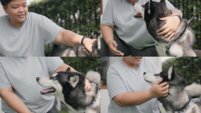 亚洲女人用爱抚摸她的狗。