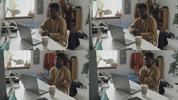 非裔美国人在家里用笔记本电脑打电话的视频