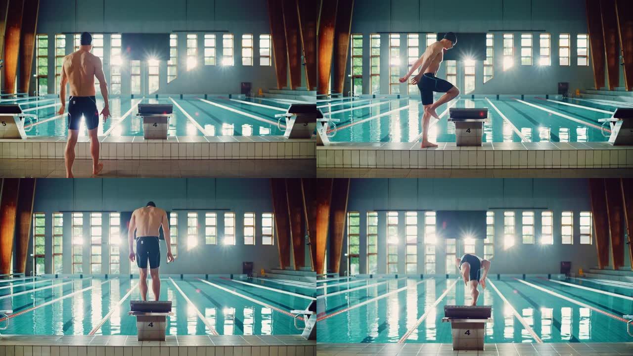 运动男游泳运动员来到起跑区，跳入游泳池。确定了为冠军而进行的专业运动员训练。电影之光。慢动作拍摄后