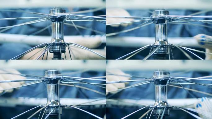 一名工厂工人建造自行车轮辋的特写镜头