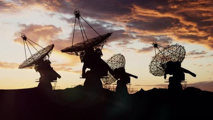 大型射电望远镜在彩色的日落天空下接收信息以获取屏幕保护程序