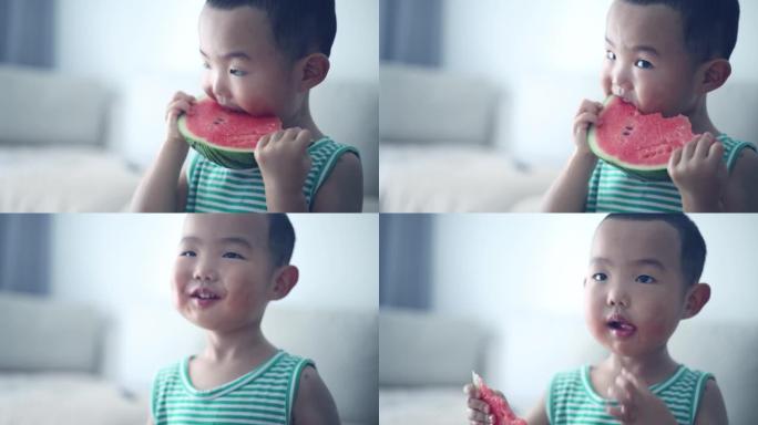 亚洲男婴吃西瓜夏季水果炎热吃西瓜