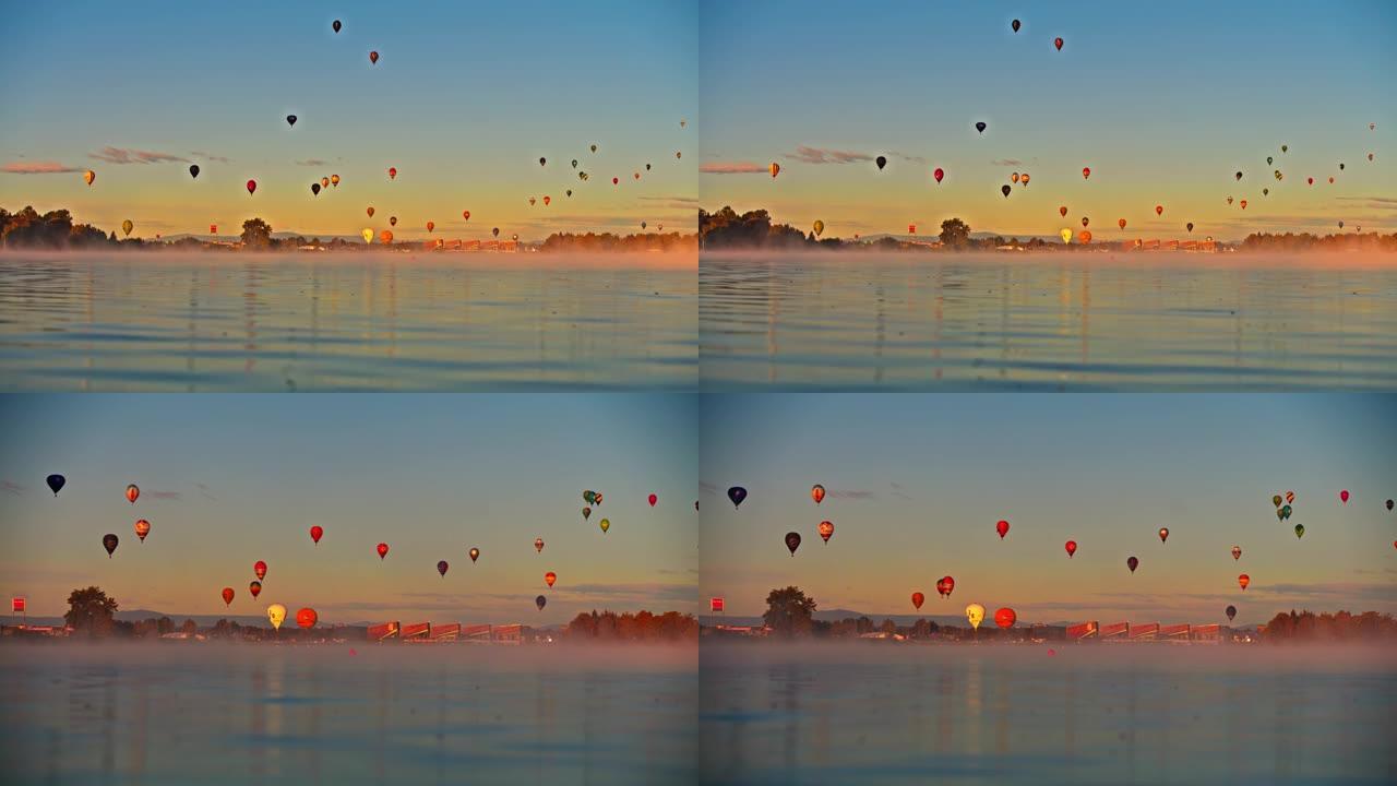 水面景观湖上宁静的天空中的热气球