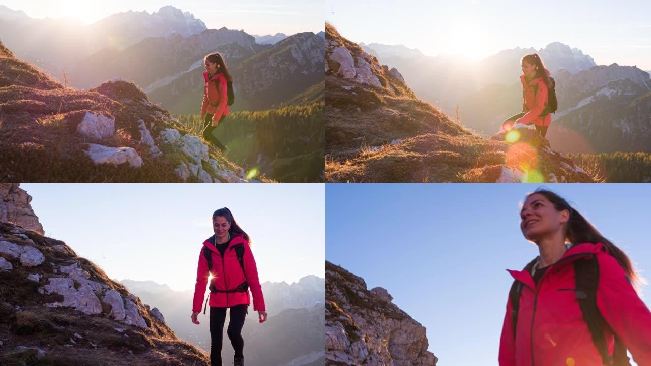 年轻女运动员徒步旅行落基山山脊环绕雄伟的山峰