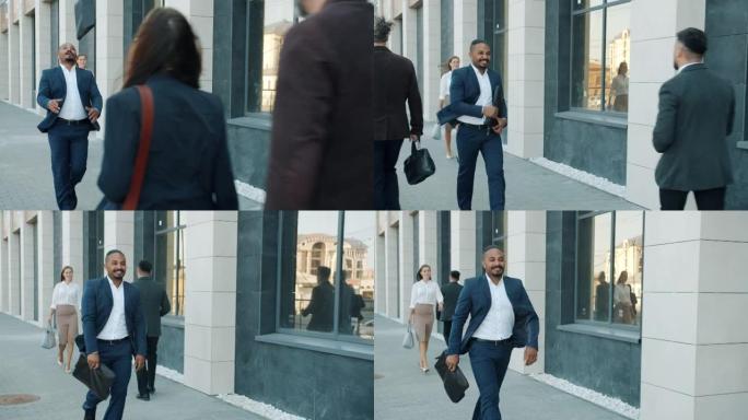快乐的中东男人走在大都会街上的肖像，表达对职业成就感到兴奋的幸福感