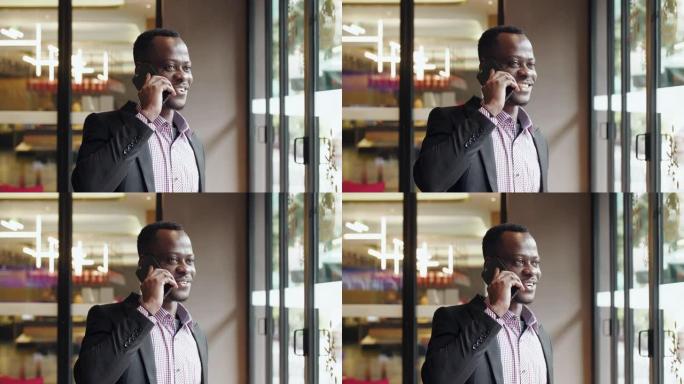 非洲商人通电话智能手机联网通话购物自拍短